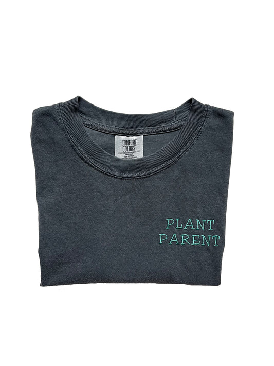 grey color t-shirt with a green color embroidered text saying plant parent