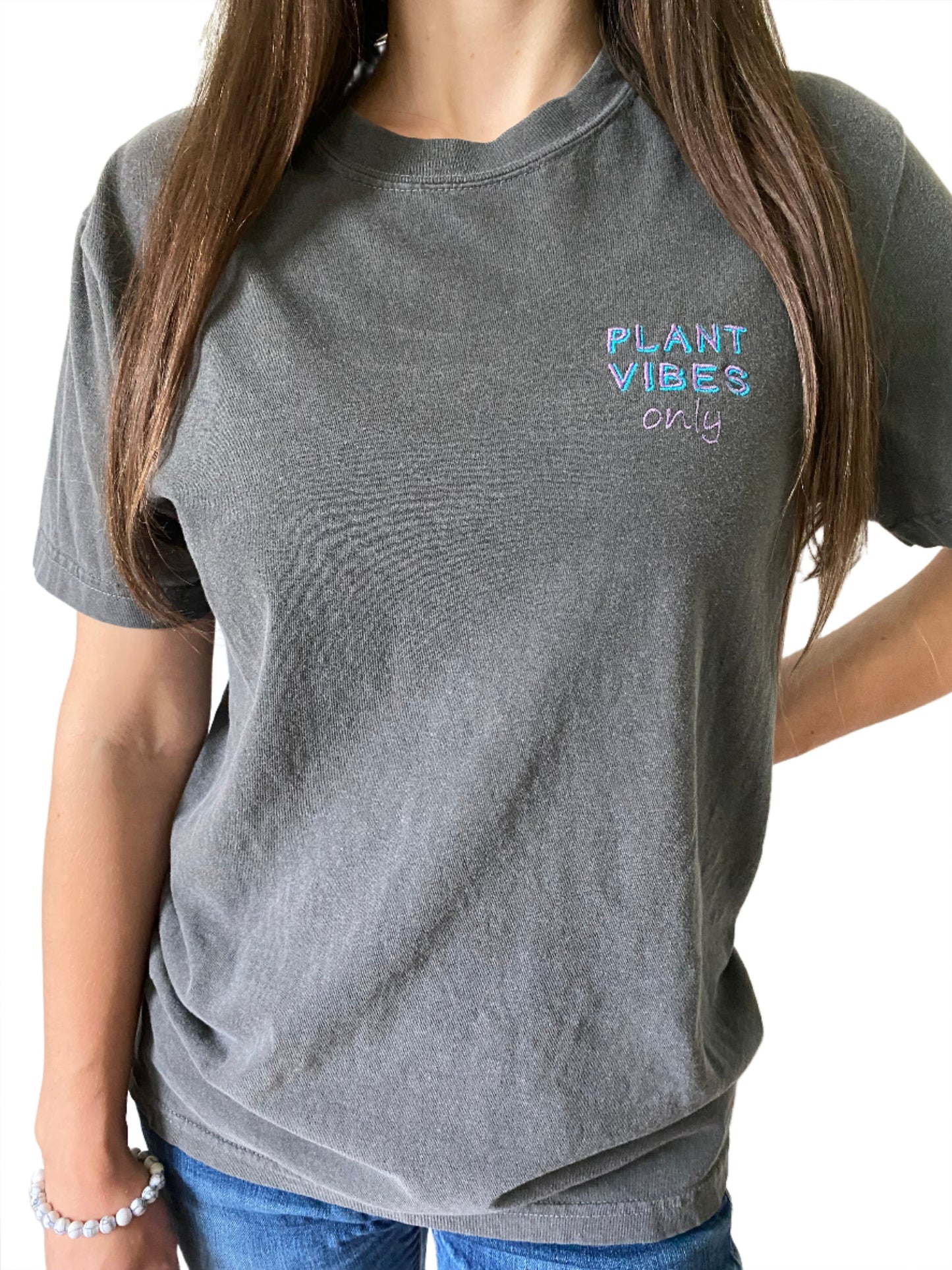 grey t-shirt with purple and blue color embroidery text saying plant vibes only